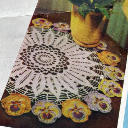 Framed In Pansy Doily